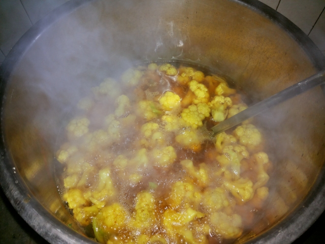 Cauliflower in a large vessel of Water and Turmeric Powder.